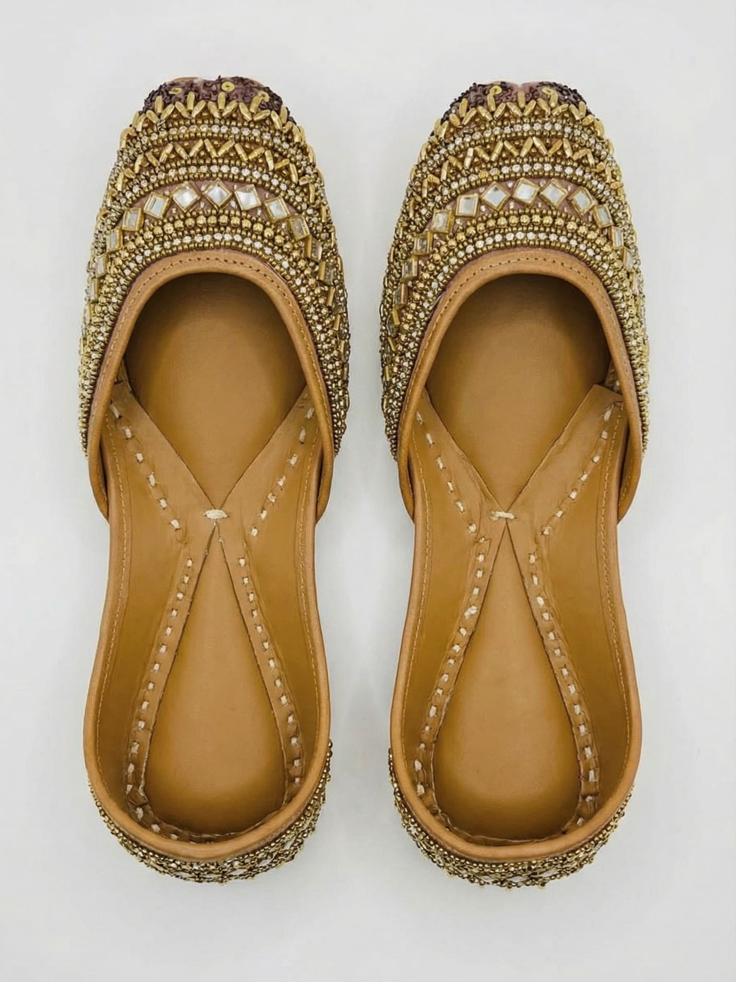 Meera juttis top view — gold zari, mirror embellishments and mauve sequin toe cap by Solemates by Palak