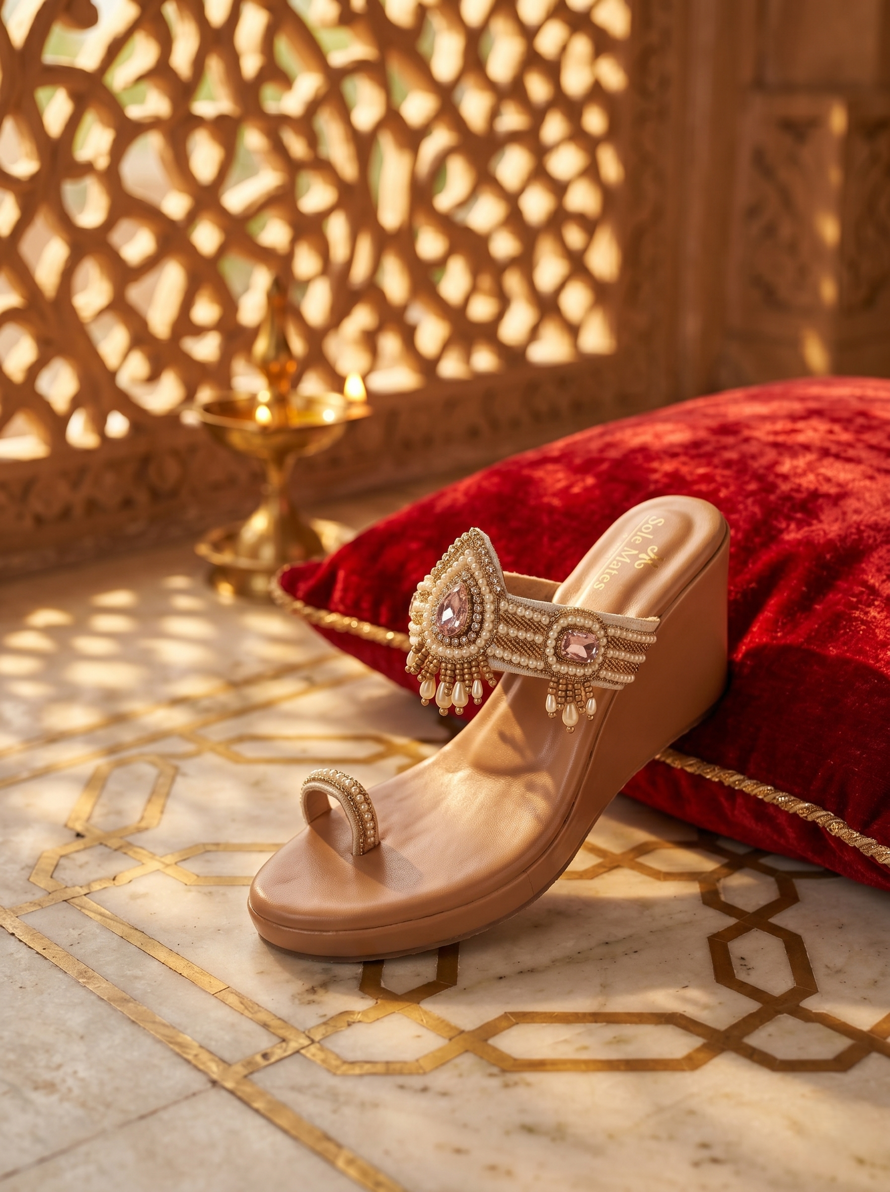 Gulabri Kolhapuri Heels side profile on red cushion — nude wedge heel with pearl and pink stone embellished front strap by Solemates by Palak