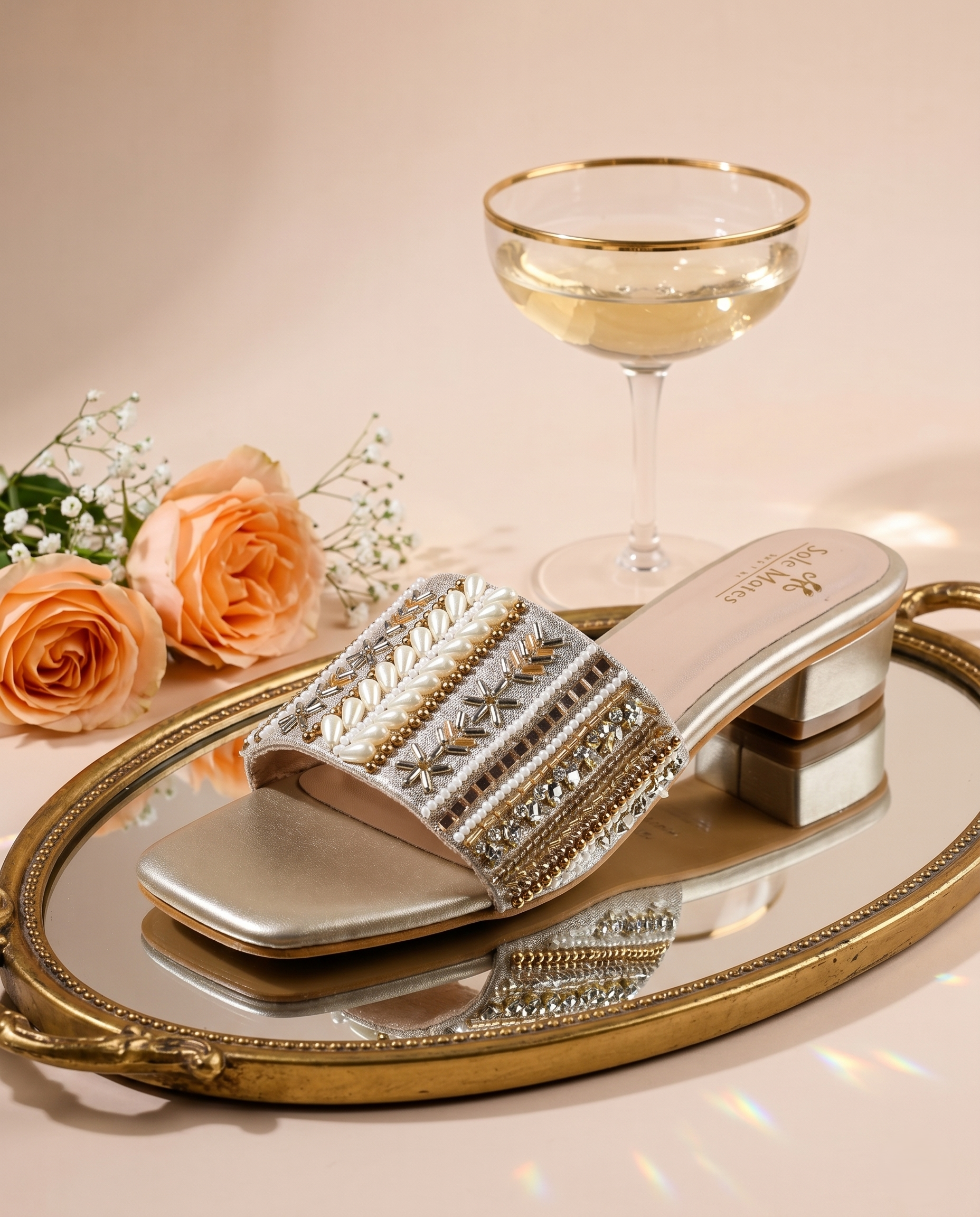 Kate Gold Sliders on gold mirror tray with rose and champagne glass — wide embellished strap with pearl clusters and multi-bead rows by Solemates by Palak