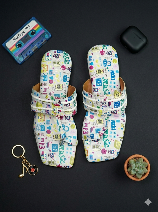 Melophile Kolhapuri Flats flat lay with cassette tape and music keychain — white music doodle print toe ring kolhapuri flats by Solemates by Palak